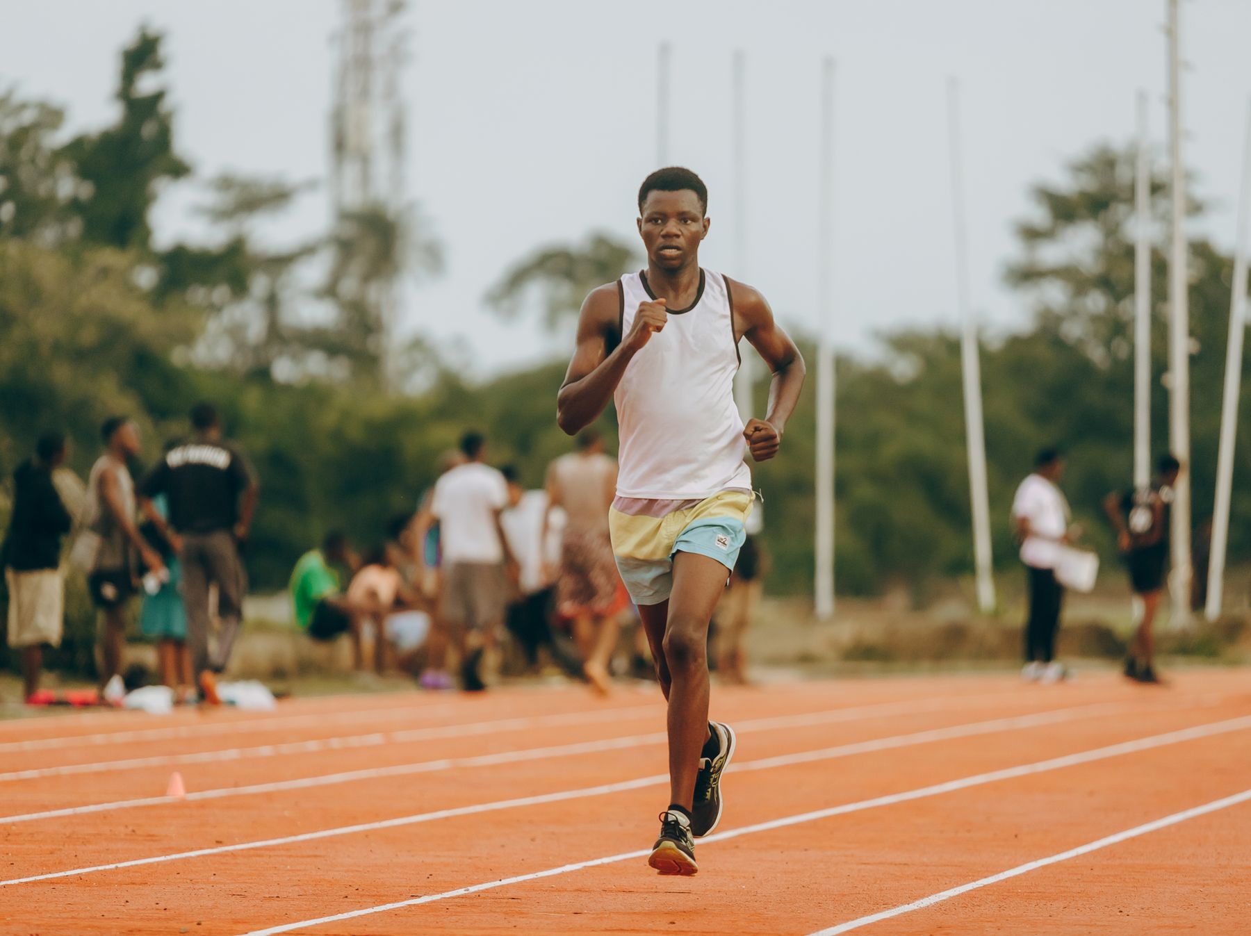 Nigerian athlete running on a Lagos track